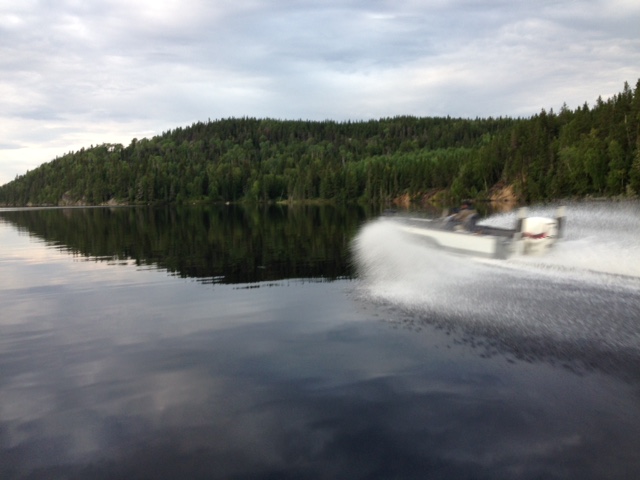 Cyril's boat is driving so fast he's not even in focus!